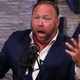 Alex Jones, our modern-day Paul Revere, warns of Michael Moore’s impending plot.